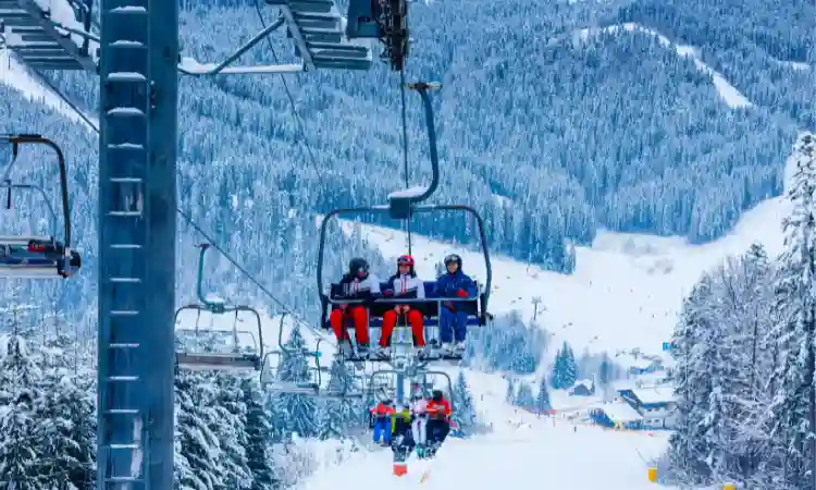 Aspen snowmass lift is shown which people take for going up the mountain for skiing downwards