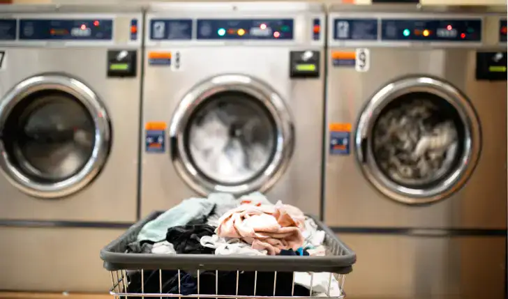 image shows hotel laundry facilities while writing the article "do hotels have washing machines" This image was sourced from Canva