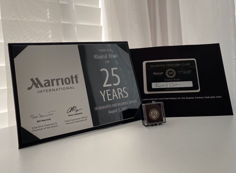 The picture shows an experience certificate of 25 years of Marriott employee