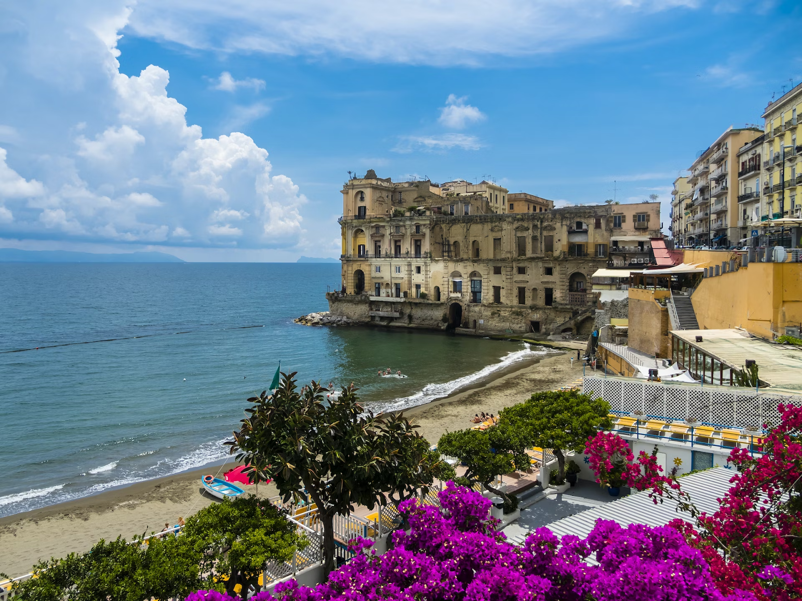Historical site along Amalfi coastline is shown in the picture during comparing with Naples