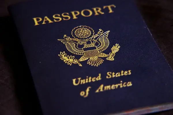 Picture shows outer cover of US passport, that is required to be shown at the hotel for booking
