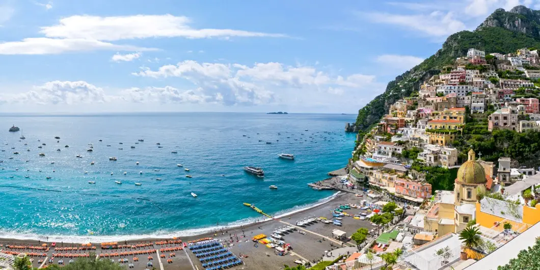 Beautiful landscape picture of Amalfi coast line is shown while comparing against lake como for your next trip
