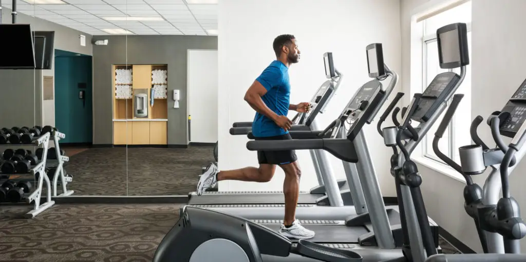 Fairfield by Marriott's fitness centre is shown while comparing it against residence inn