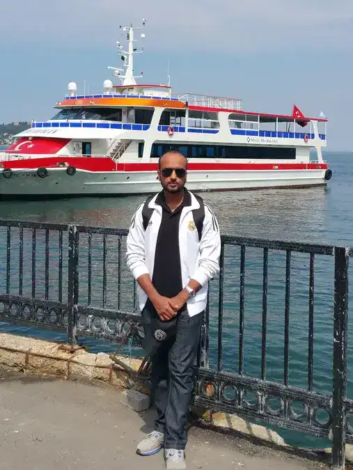 Imran satti, owner of trip-pursuit poses with a cruise ship in Turkey