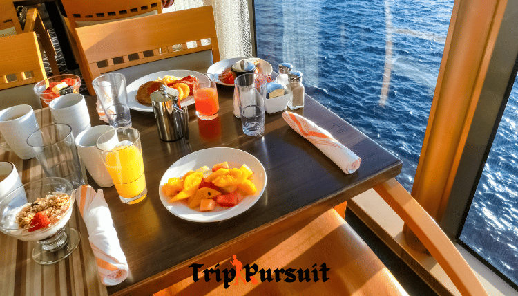 having my breakfast onboard scarlet lady   with a nice beach view