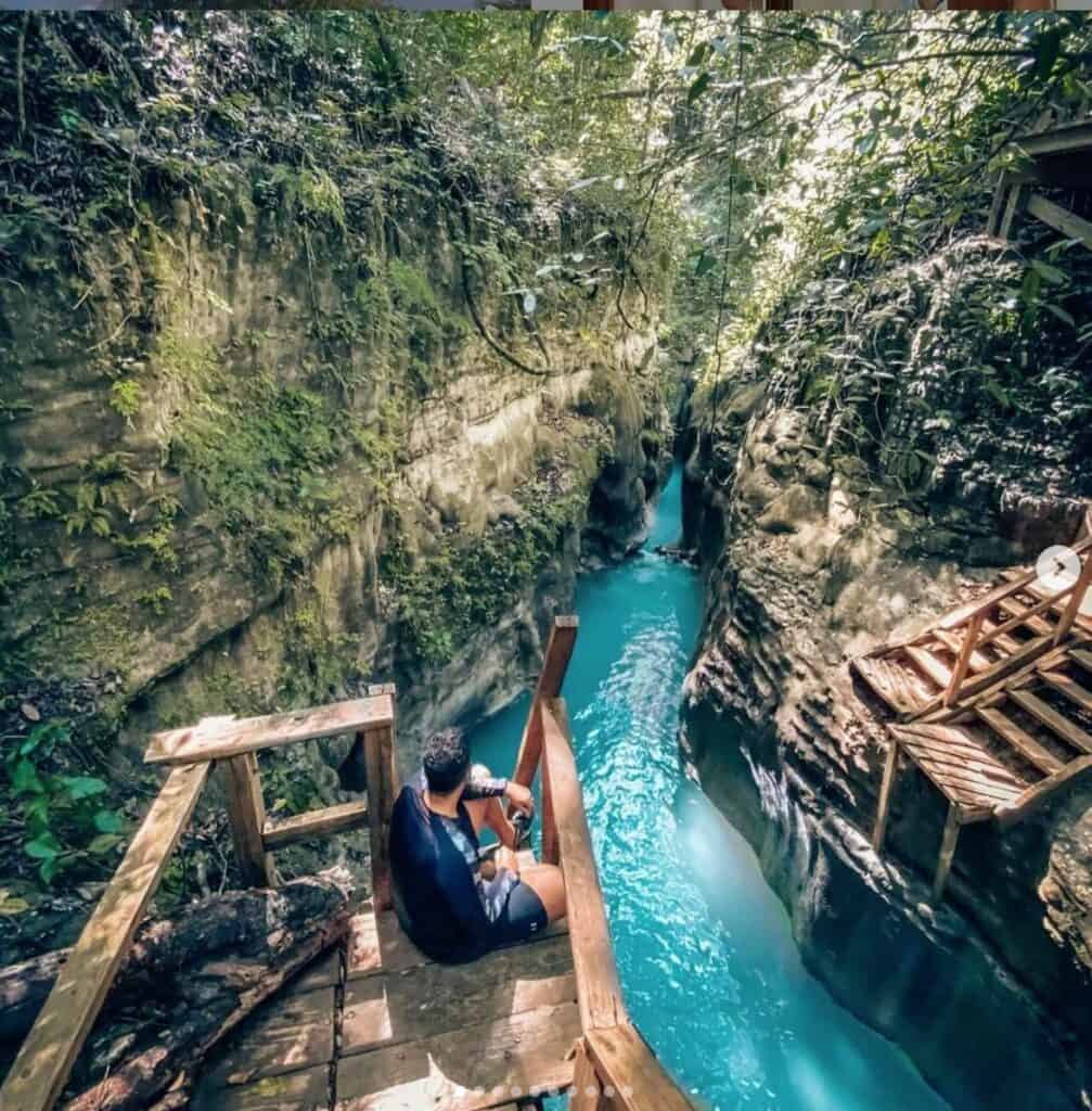 View of the 27 Waterfalls of Damajagua in the Dominican Republic, with adventurers climbing and cascading down the waterfalls