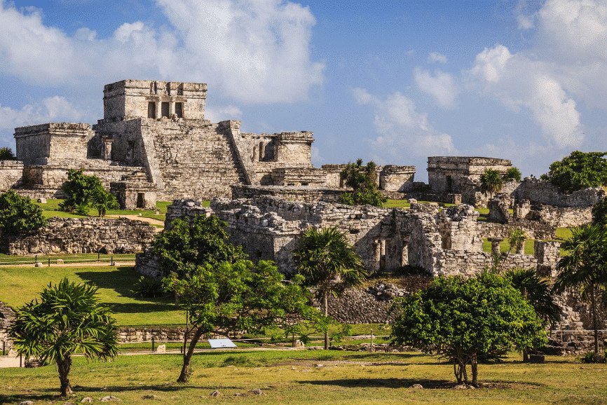 Stunning view of the Mayan Ruins of Tulum in Mexico, with ancient structures overlooking the Caribbean Sea, a must-see attraction during a Scarlet Lady shore excursion