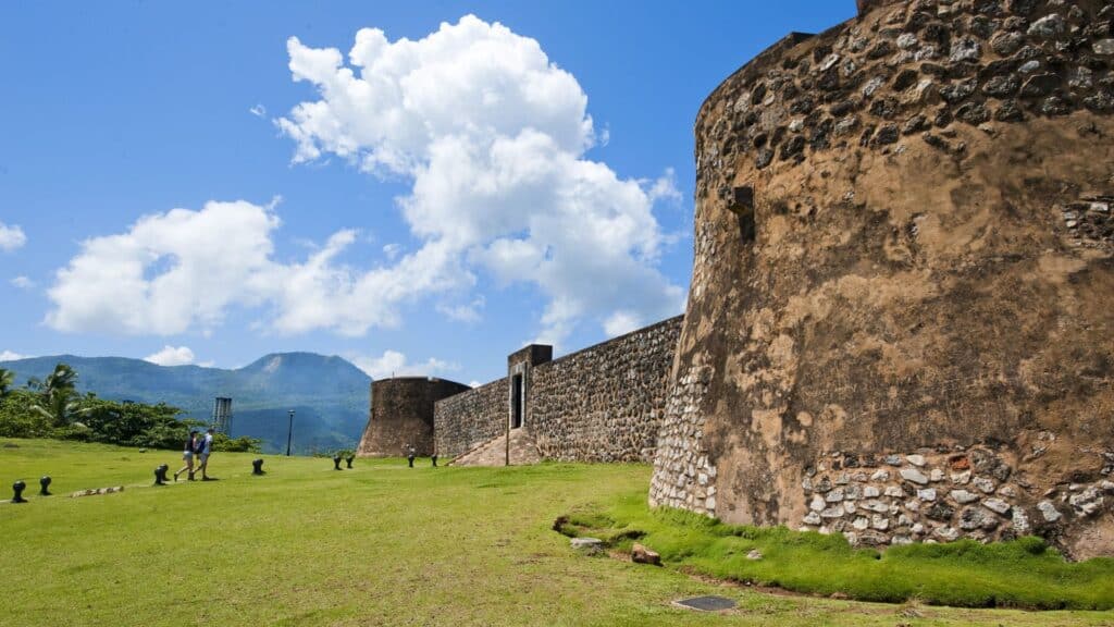 View of San Felipe Fortress and the Amber Museum in Puerto Plata, Dominican Republic, showcasing historic architecture and vibrant amber displays, a cultural highlight during a Scarlet Lady shore excursion