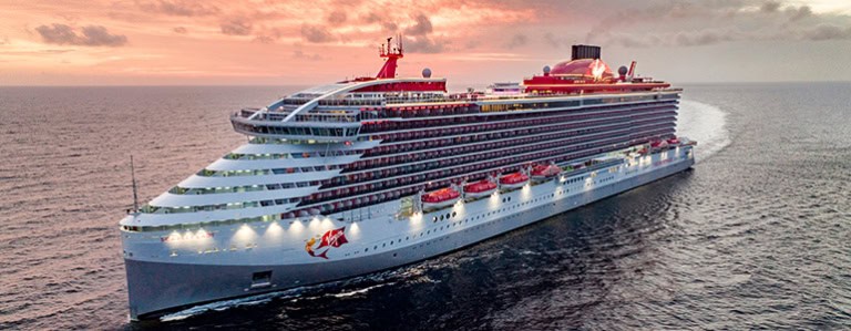 scarlet lady cruise sailing in the sea in golden hour